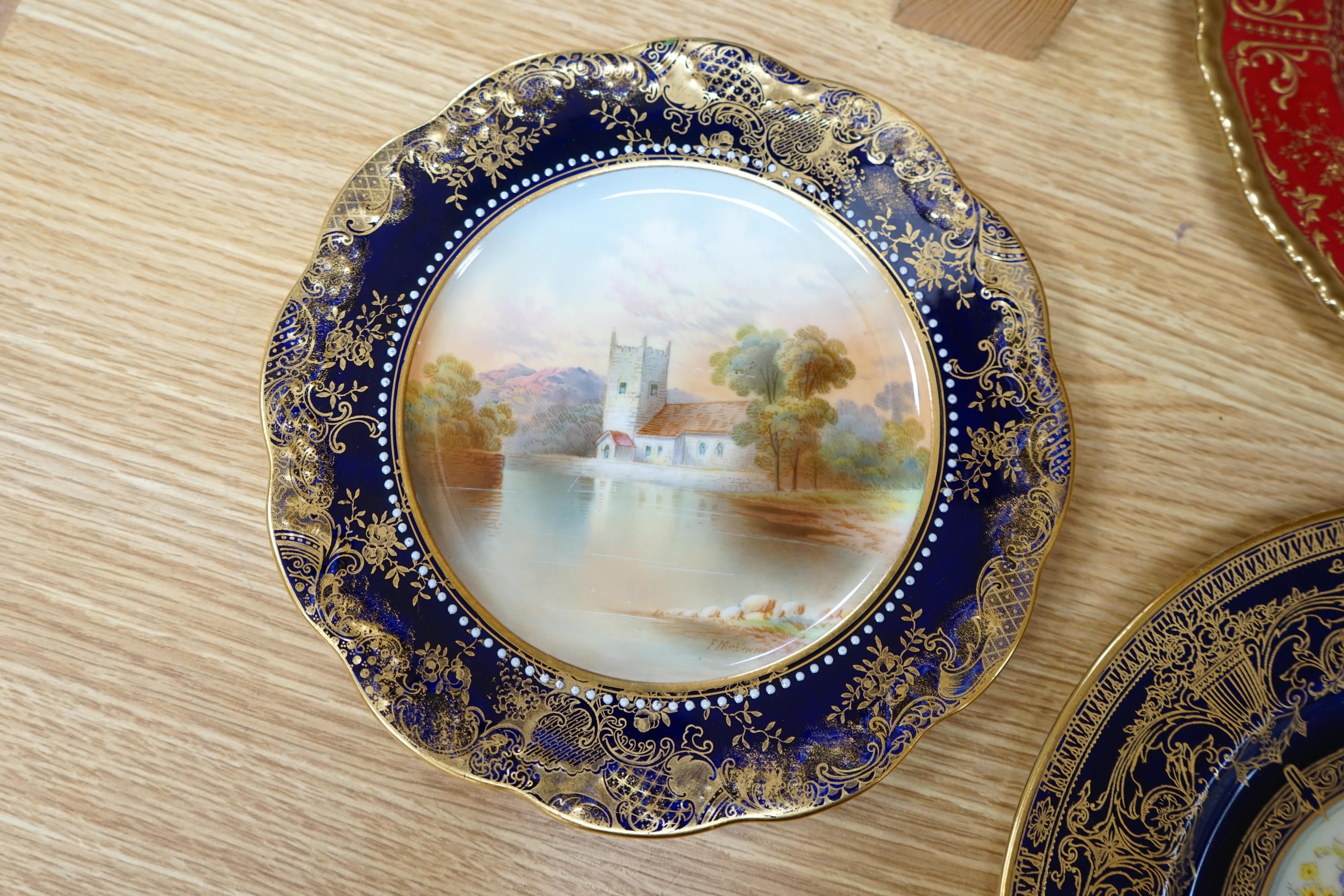 A collection of English porcelain plates, highlights include a Royal Doulton fruit painted cabinet plate signed F Harper, a Royal Worcester flower painted cabinet plate signed E Phillips, and Aynsley plate painted with a